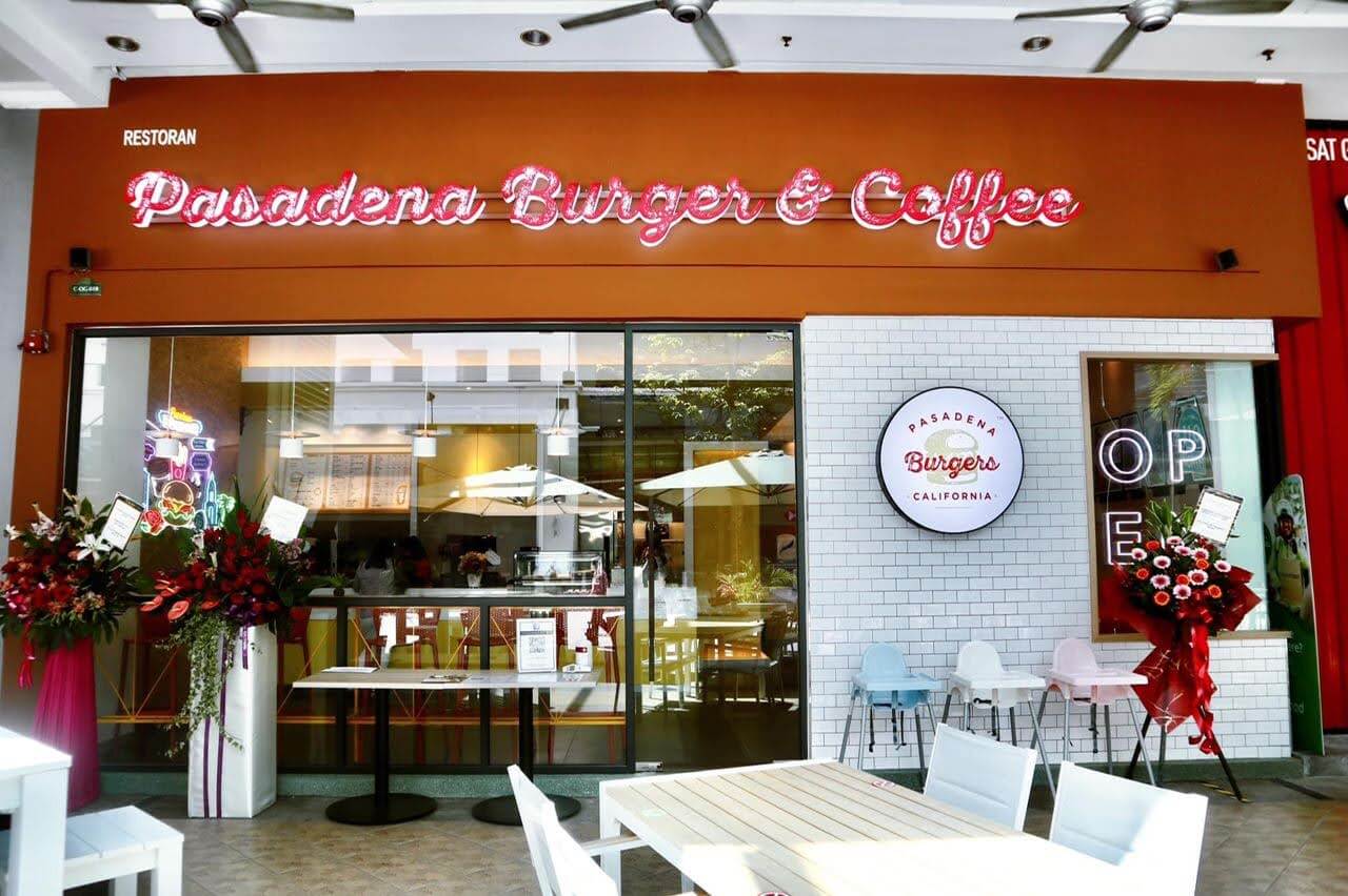 Pasadena Burger and Coffee storefront with red signage and floral opening arrangements