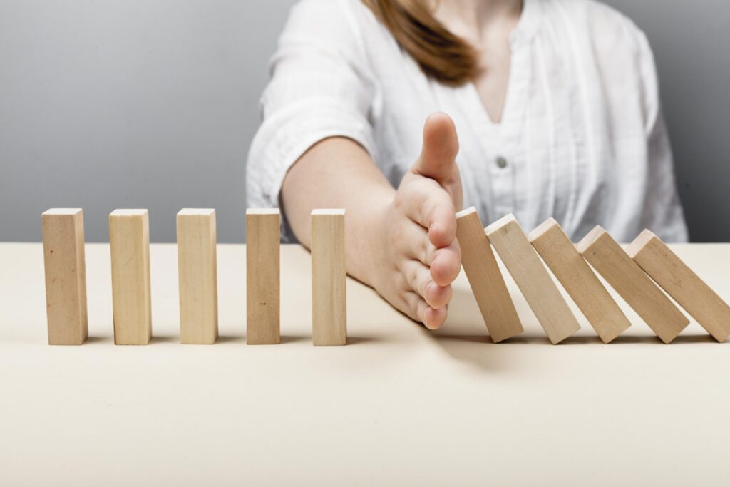 woman-stopping-wooden-pieces