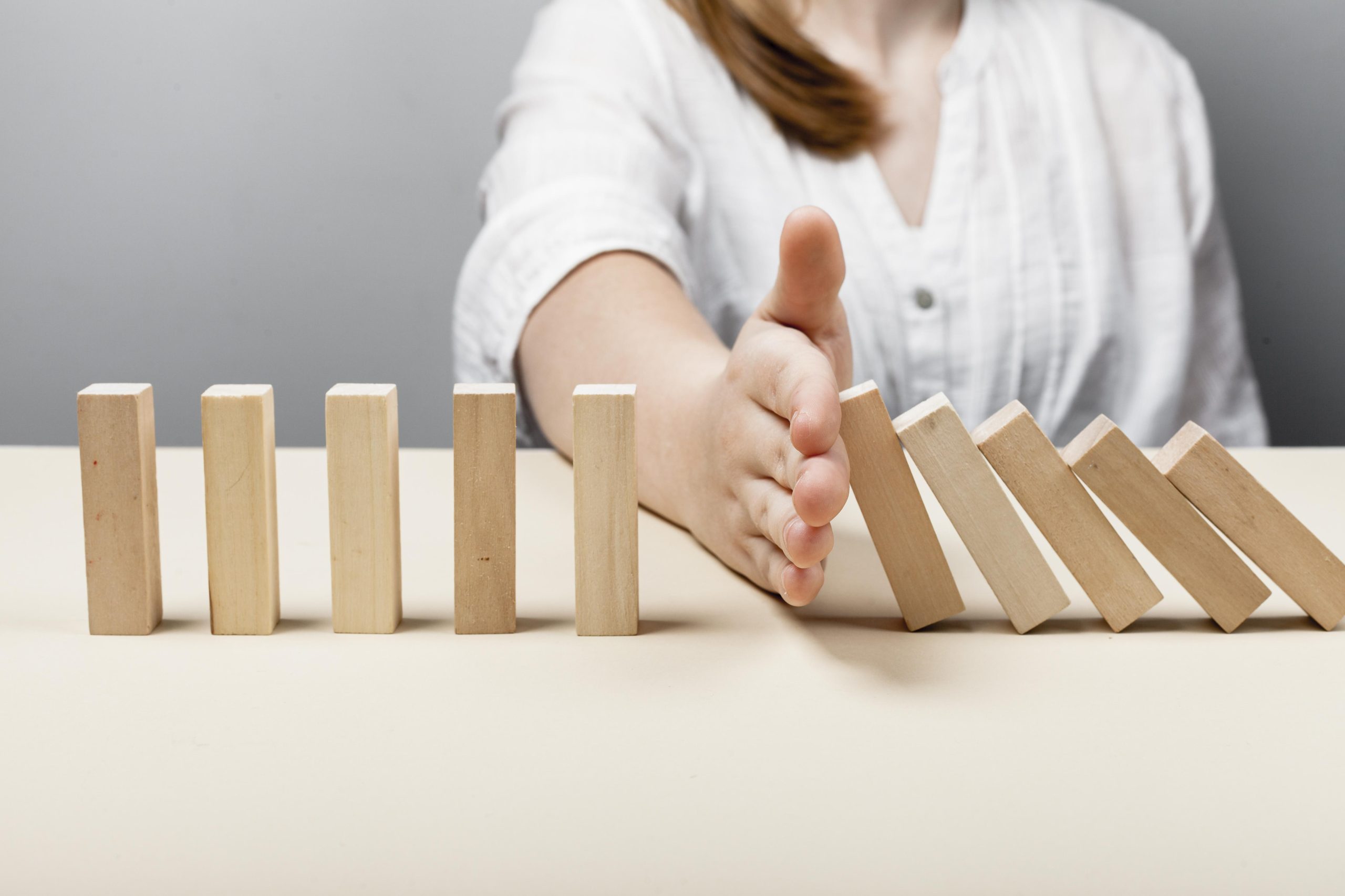 woman-stopping-wooden-pieces